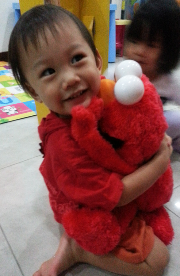 hugging elmo doll