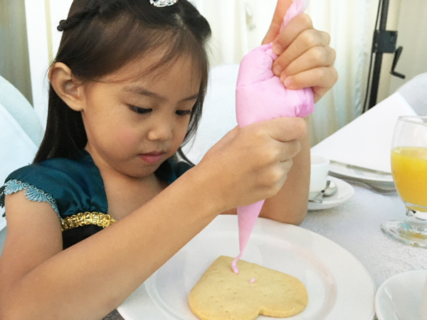 Decorating a cookie to show someone an act of kindness