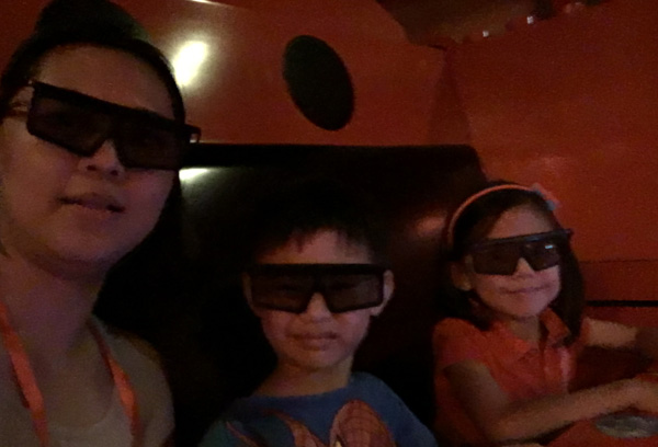 The two littles insisted they were afraid and needed to be with me. They gamely put on those 3D glasses nonetheless...