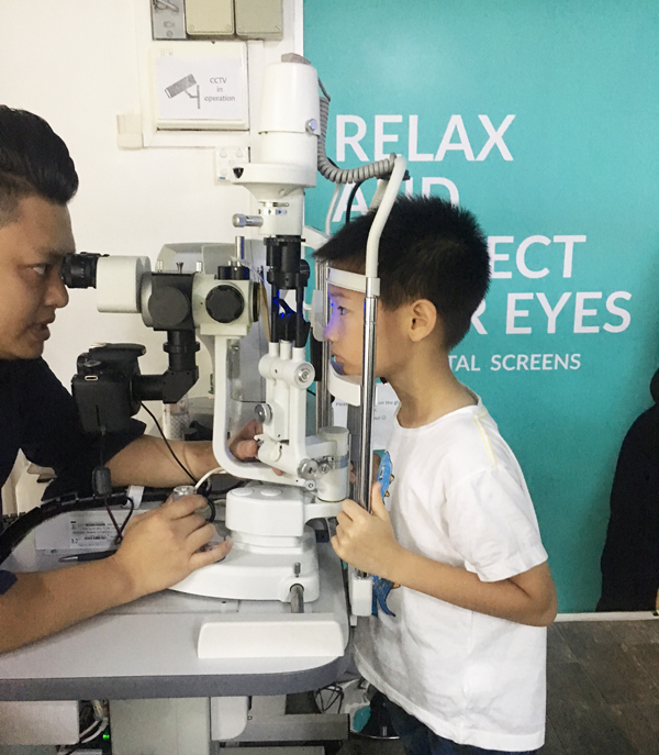 Checking the health of his cornea