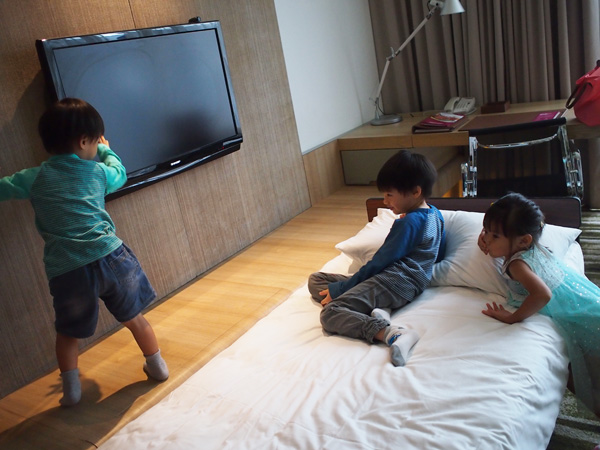 Checking out the room, and lazing on the rollaway bed