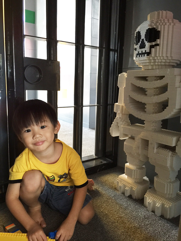 Squatting next to a skeleton!