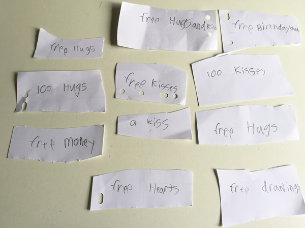 My coolest present ever: cards from my eldest son which I can use to redeem free hugs, kisses, hugs AND kisses, drawings, and check-this-out - free money!