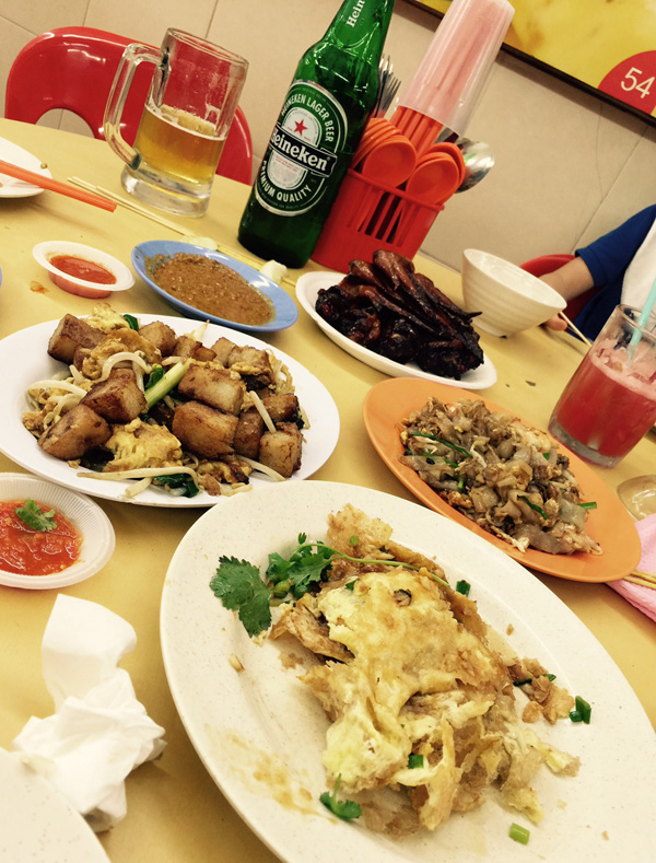 Our dinner consisting of chicken wings, satay, oyster omelette, carrot cake, char kway teow, beer (for the adults) and juice (for the young 'uns)