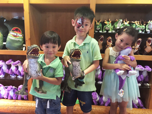 Toy store fun: Becks grab a stuffed toy but the boys... are all for jaws and teeth